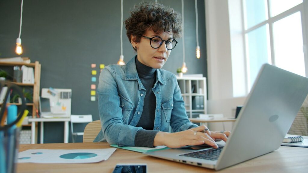 Business owner reviewing information on a laptop while preparing a Google Business Profile appeal