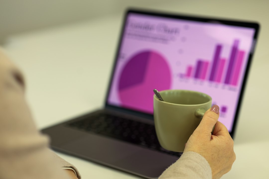Laptop showing analytics charts for SEO keyword cannibalization analysis